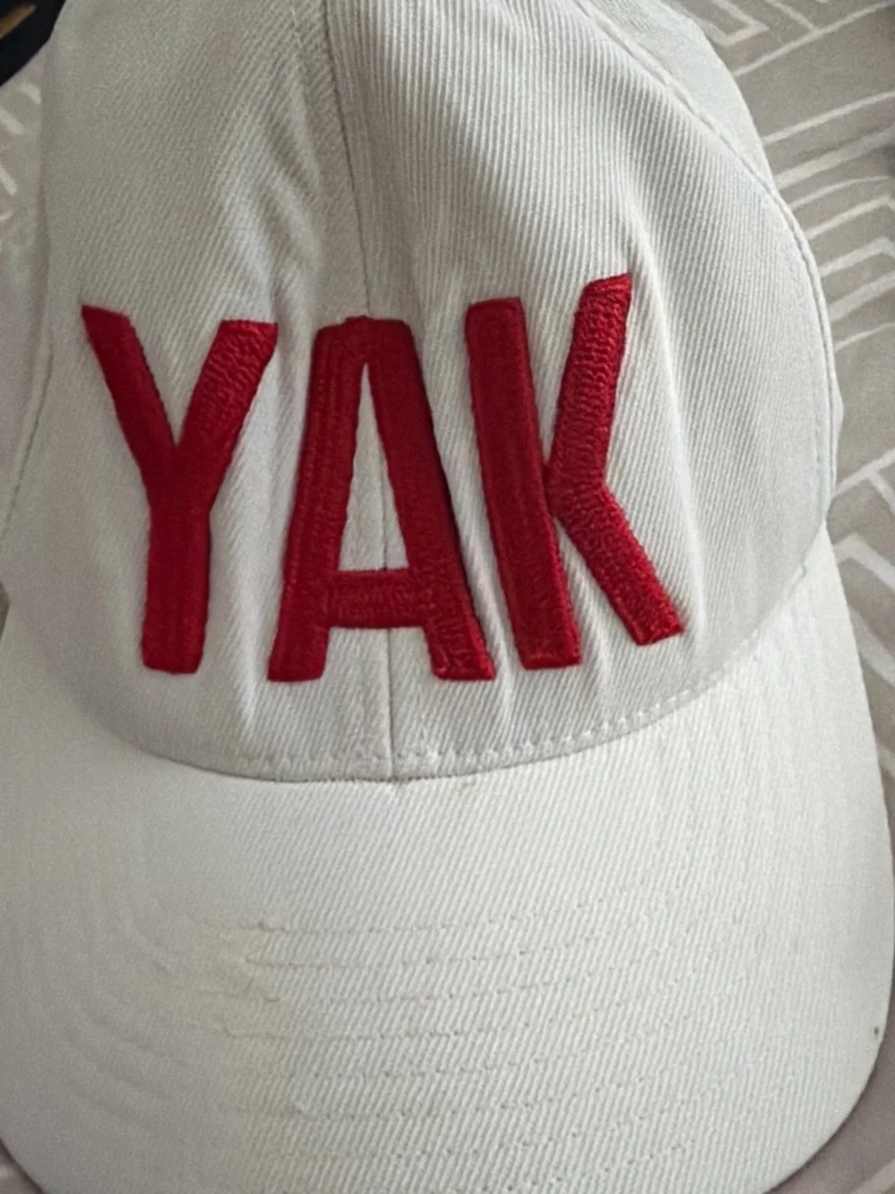 G/FORE White Baseball Cap with Red 'YAK' Embroidery